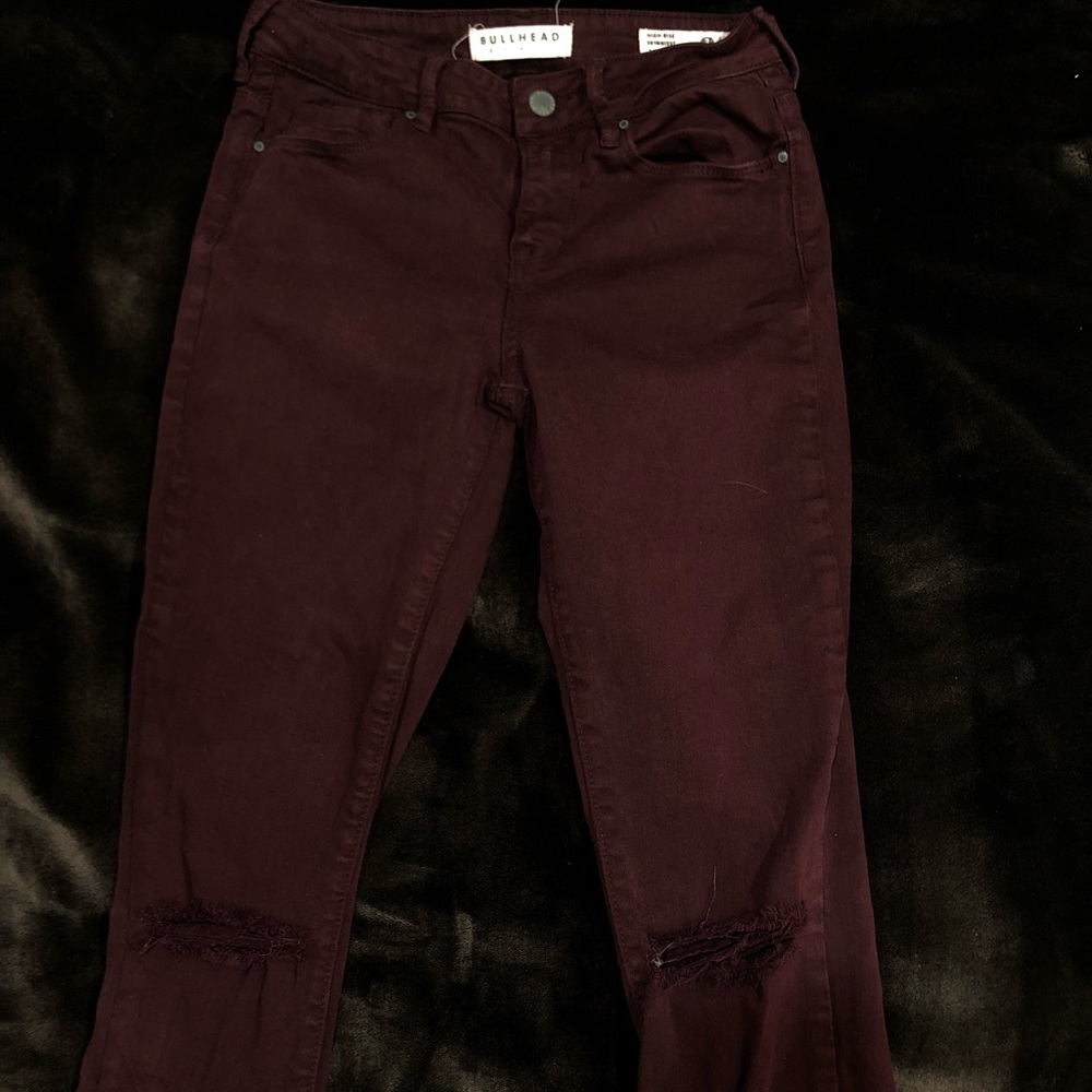 Maroon skinny jeans w/ ripped knees